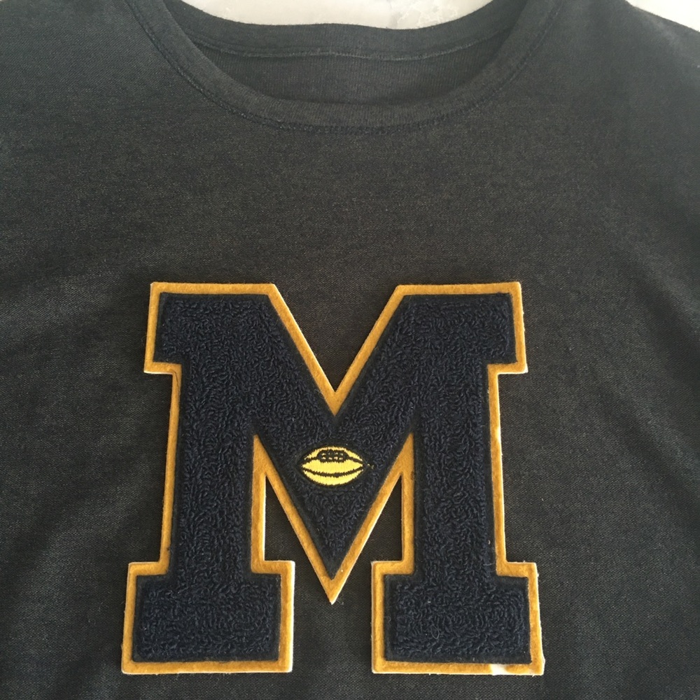 Vintage letter M with football insignia. 6.5” x 6.5” Perfect for jkt or sweater!